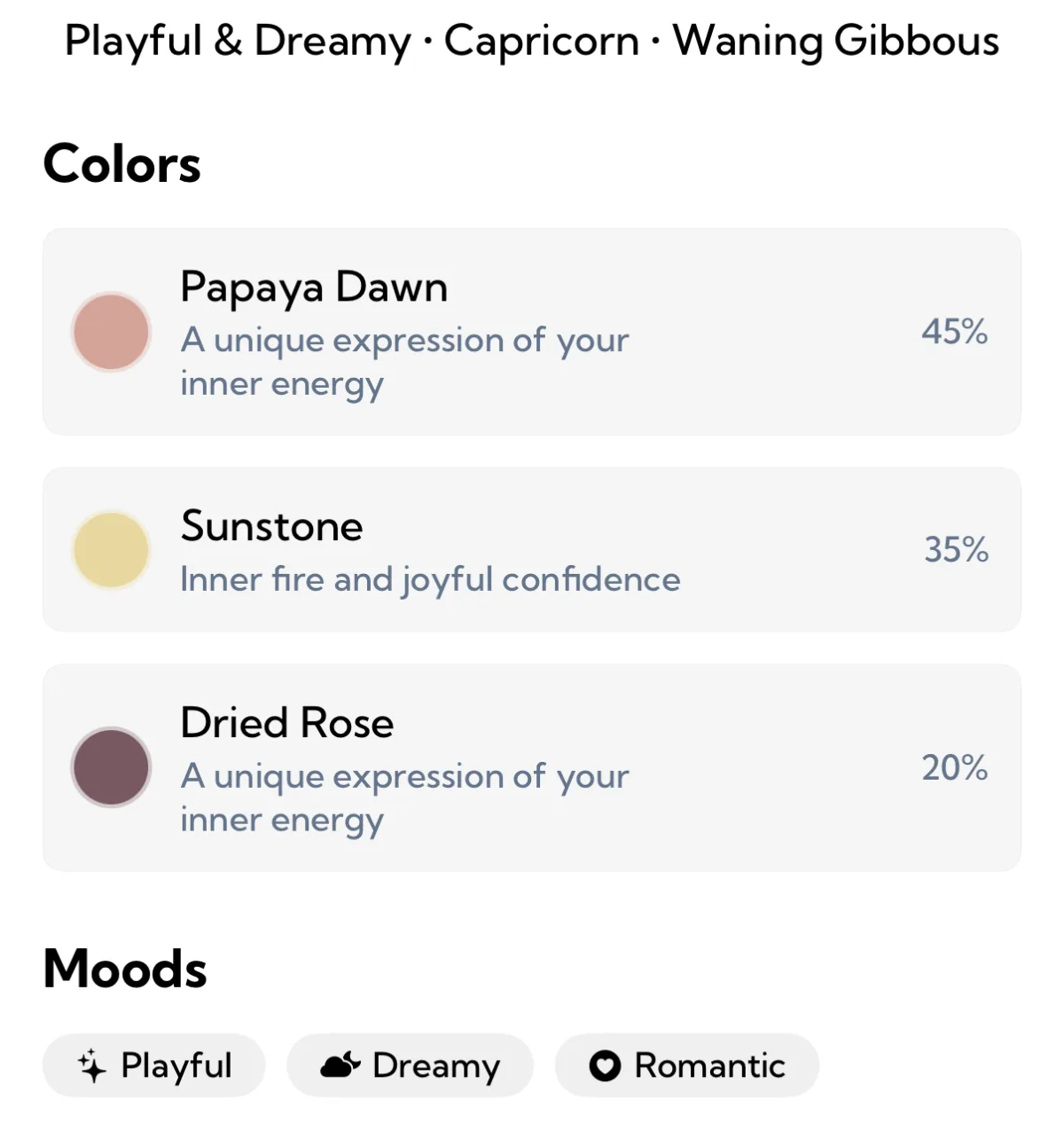 The Colors section of an Aura Color reading for Playful and Dreamy, Capricorn, Waning Gibbous: Papaya Dawn at 45 percent with a salmon pink swatch, Sunstone at 35 percent with a pale yellow swatch described as inner fire and joyful confidence, and Dried Rose at 20 percent with a deep mauve swatch, above the moods Playful, Dreamy and Romantic